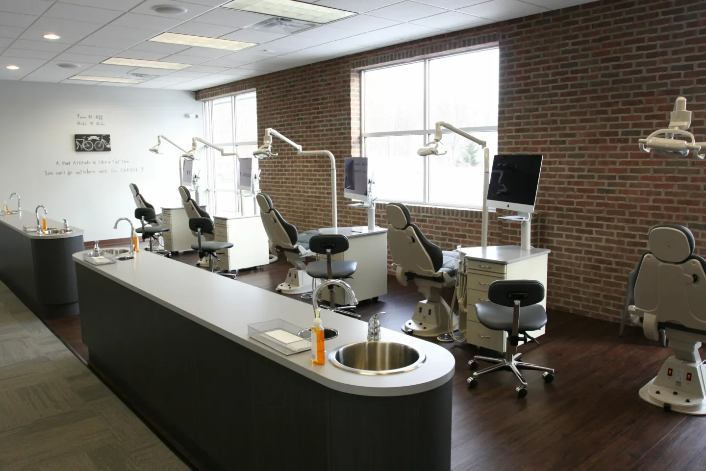 Modern dental operatory with integrated workstations supported by Brotherly Technology